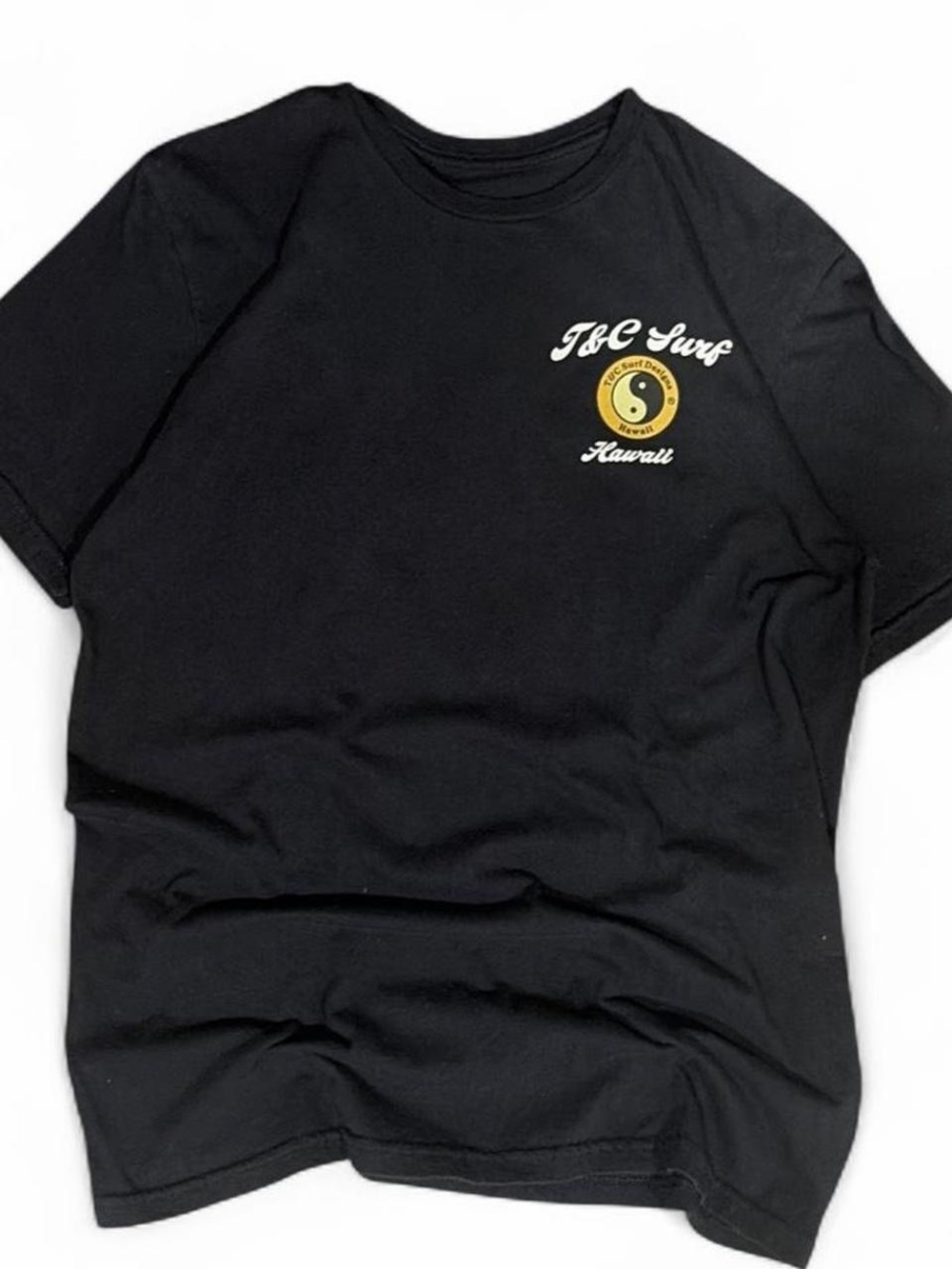 Black Short Sleeve Tee with Small Yellow Chest Graphic
